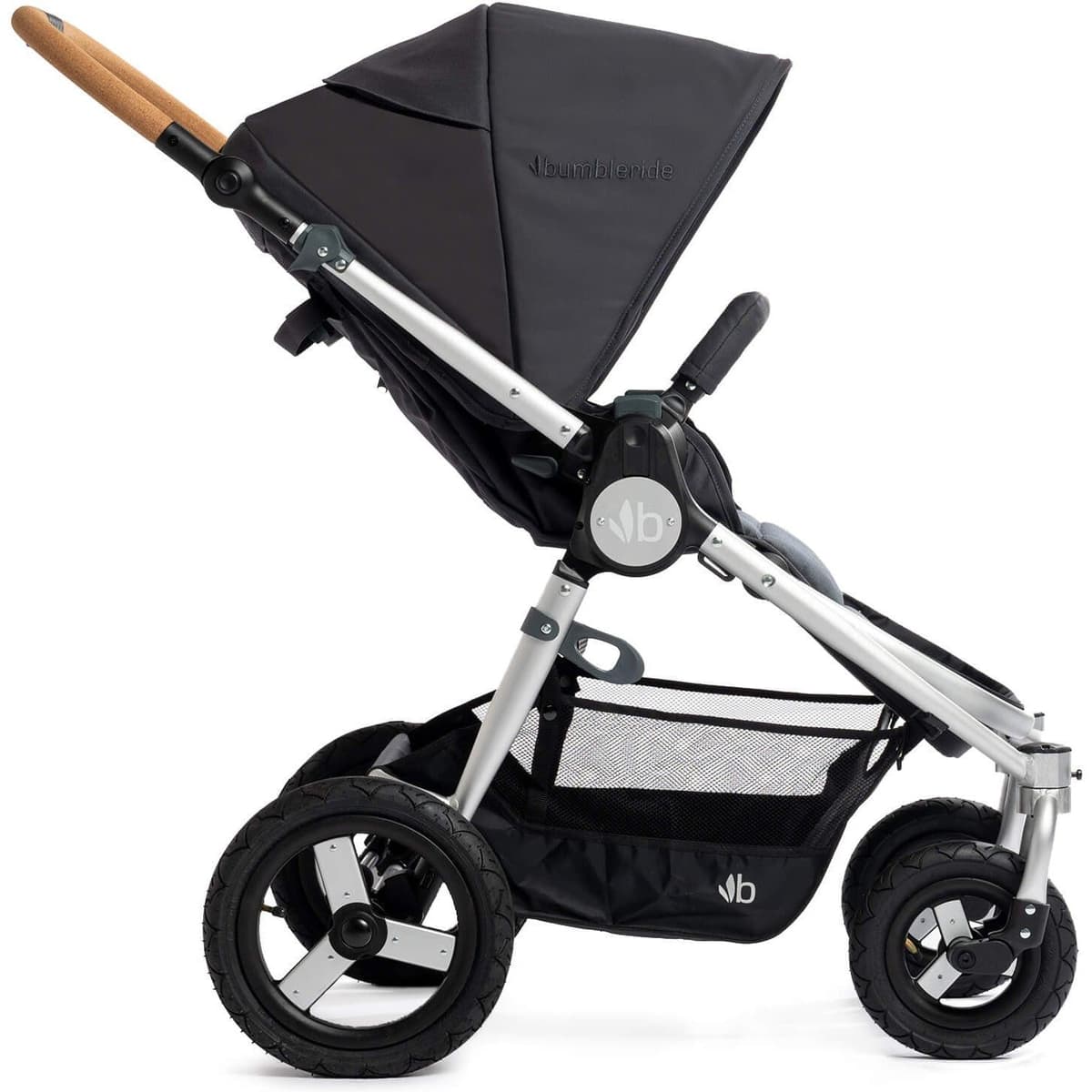 Bumbleride Era stroller in forest green with parent-facing seat in a city park setting
