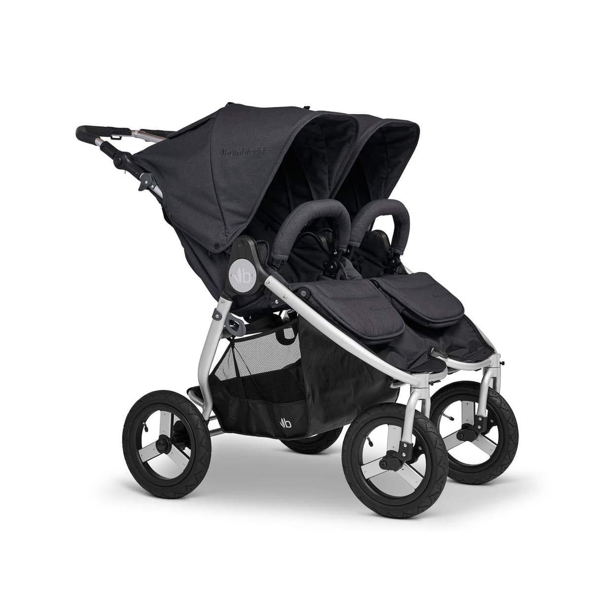 Bumbleride Indie Twin double stroller in Dawn Grey on a packed dirt trail with two children seated