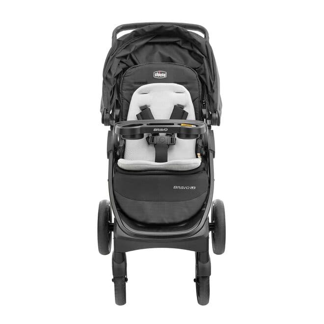 Chicco MiniBravo stroller in sand color with KeyFit infant car seat attached in a suburban driveway