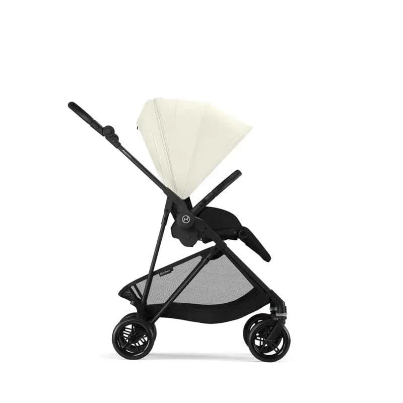 Cybex Melio Carbon stroller in lava grey with carbon fiber frame folded on a city sidewalk