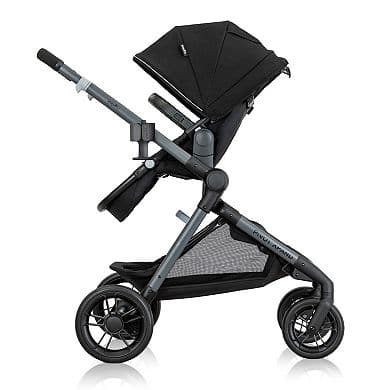 Evenflo Pivot Xpand stroller in Stallion Black in single mode on a suburban sidewalk