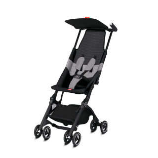 GB Pockit Air stroller folded beside a beach bag and sandals, showing its vacation-ready compact size