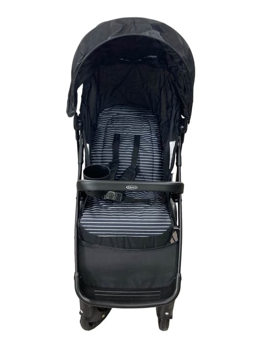 Graco NimbleLite lightweight stroller in grey and black folded next to a car, showing compact travel size