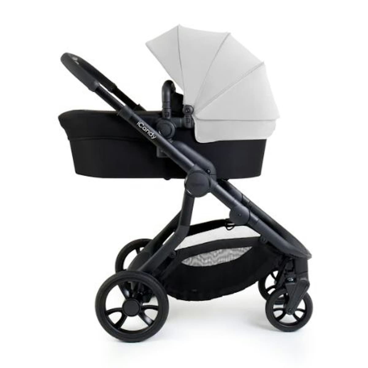 iCandy Orange 4 in Black Edition with two seats in stacked tandem configuration on a city street