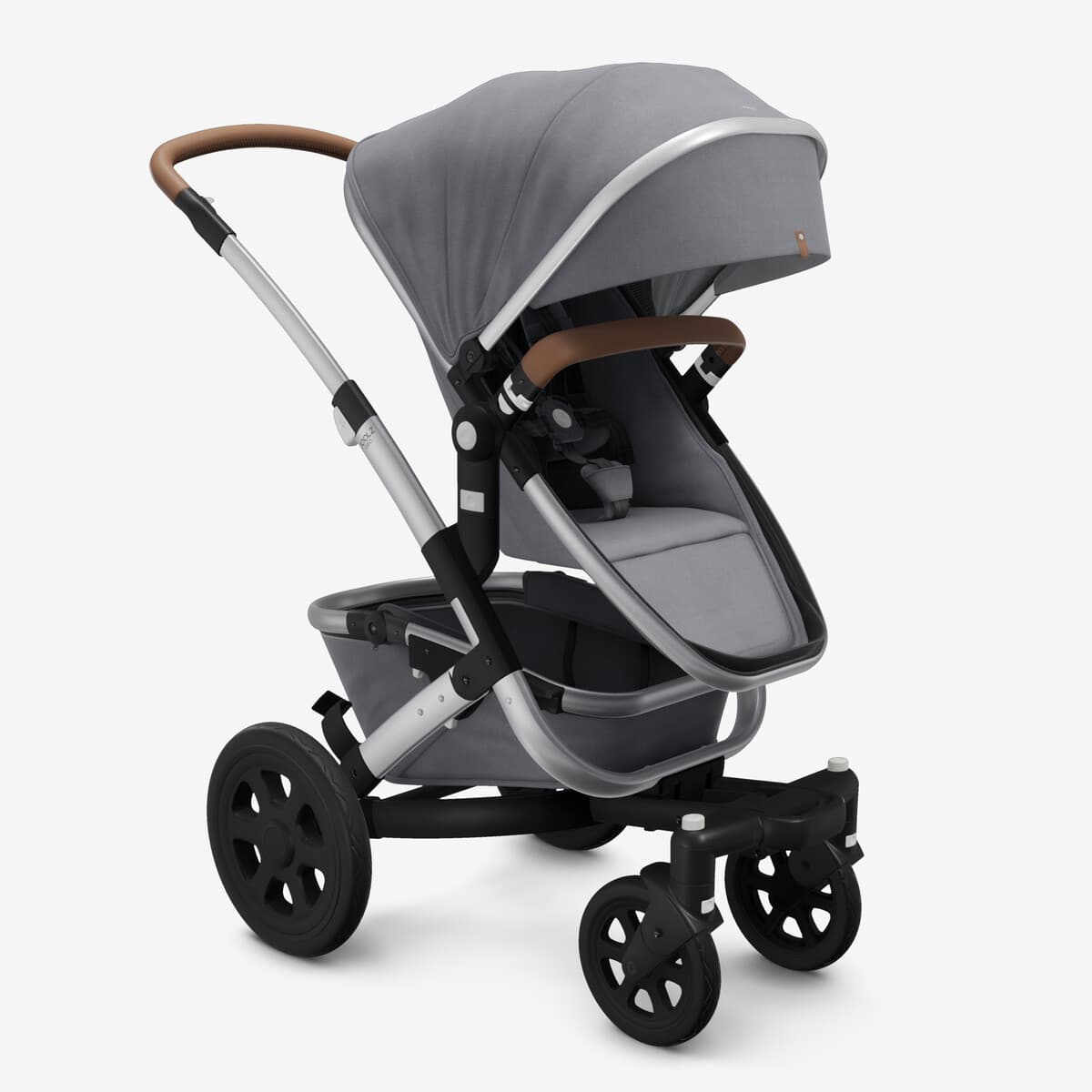 Joolz Geo 3 in Space Black in Duo configuration with upper and lower seats on a European-style city street