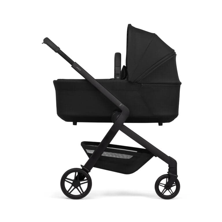 Joolz Hub 2 stroller in forest green with compact fold profile in an urban apartment setting