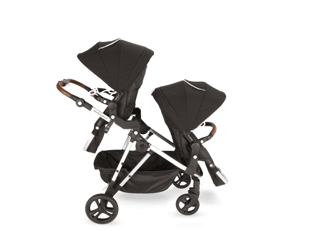 Mockingbird Single-to-Double 3.0 stroller in black configured as a double on an urban sidewalk