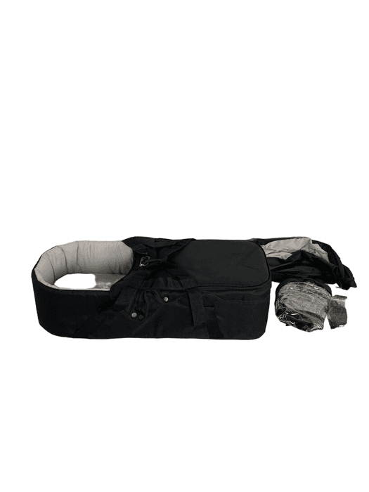 Mountain Buggy Terrain jogging stroller in black on a rugged trail with large air-filled tires