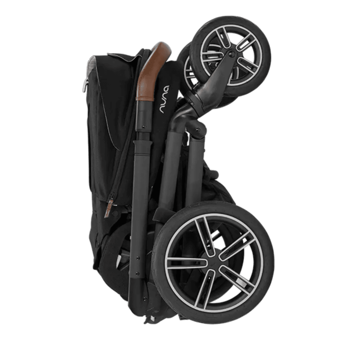 Nuna MIXX Next stroller in caviar color with parent tray on a city sidewalk