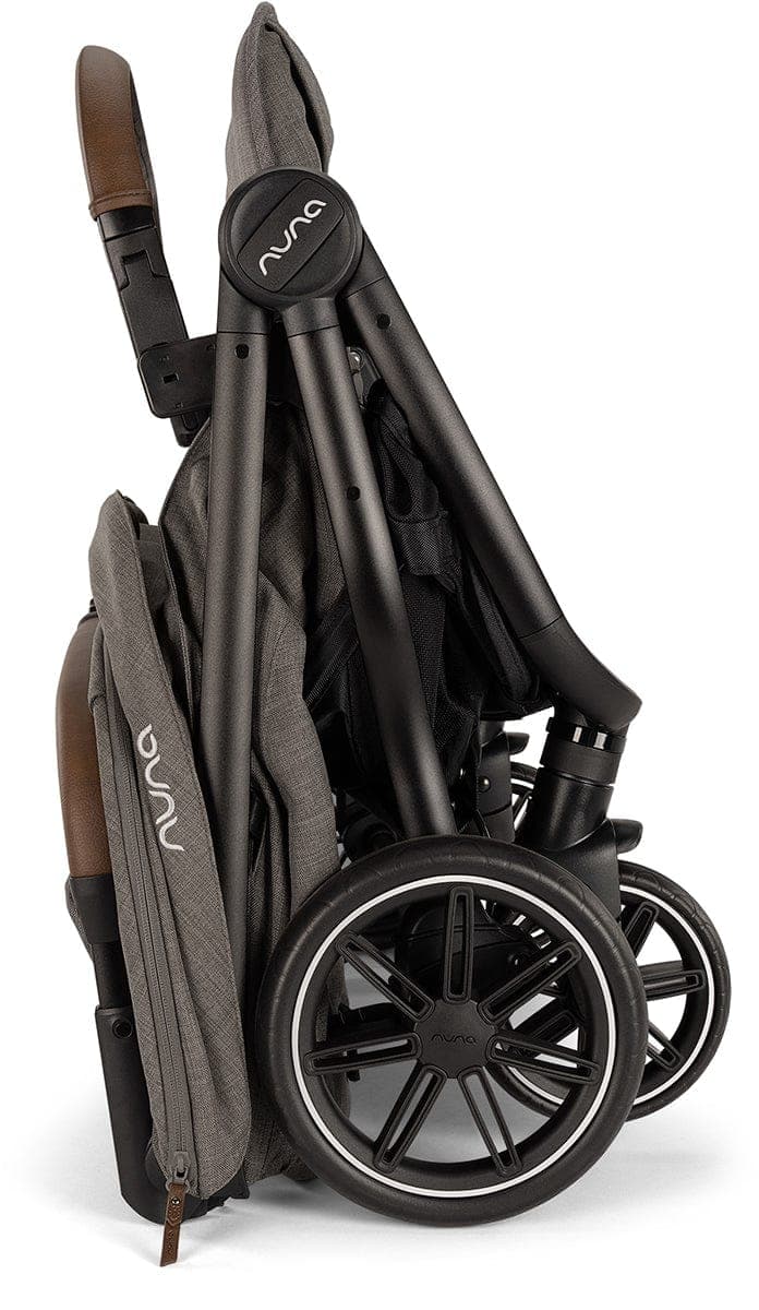 Nuna TRVL Dubl side-by-side double stroller in caviar color on an airport terminal floor