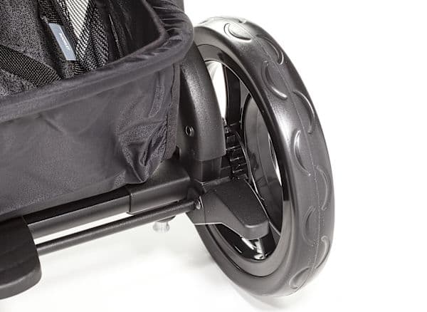 Peg Perego Booklet 50 stroller in terracotta color with Italian leather handlebar on a cobblestone street