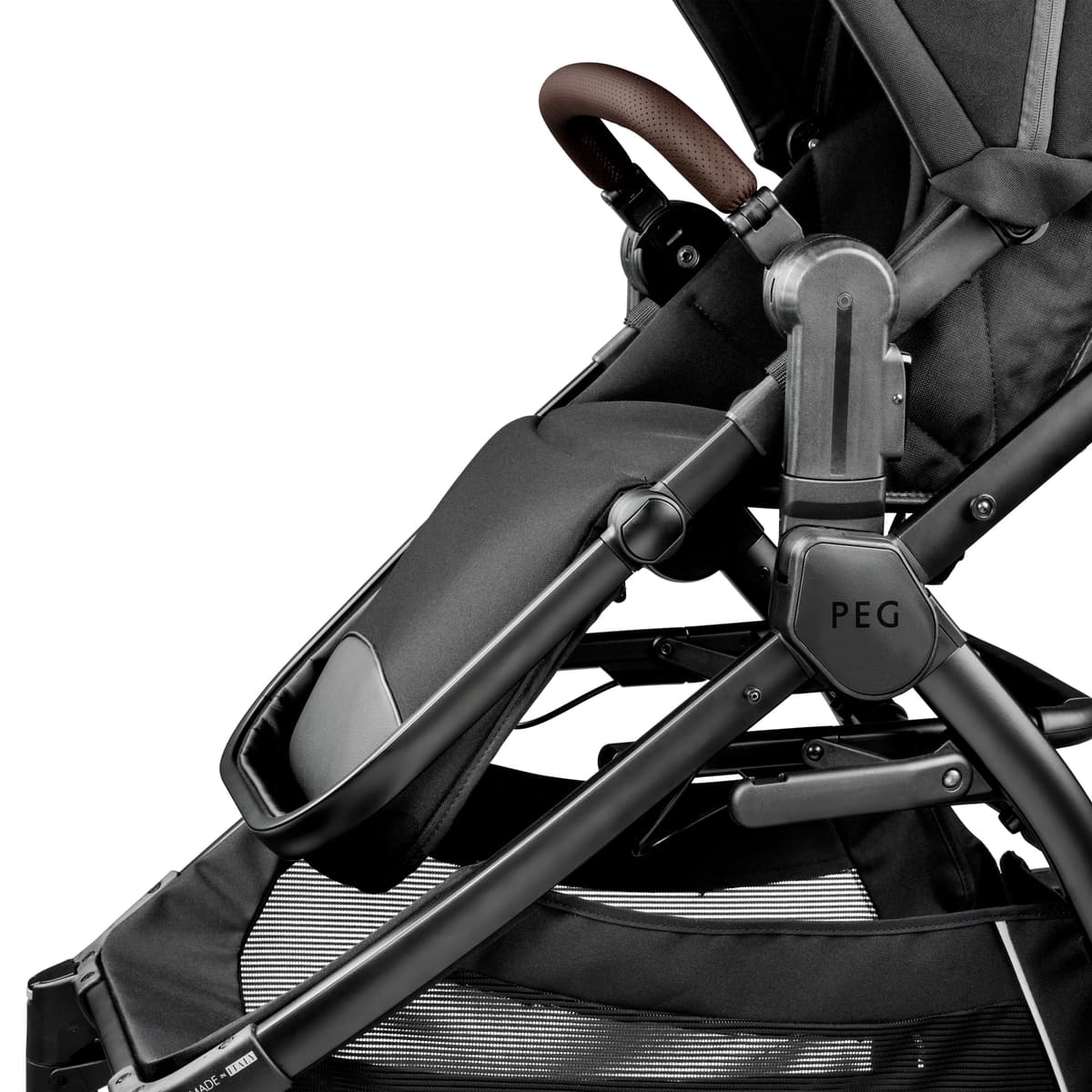 Peg Perego YPSI stroller in obsidian black with reversible seat in a city park setting