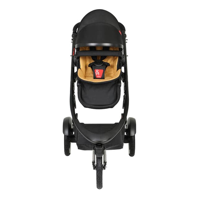 phil&teds Sport inline double stroller in black with double kit attached, on a city path