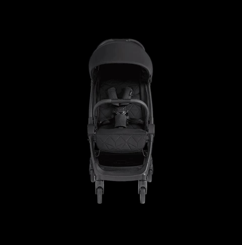 Silver Cross Clic stroller in stone color with lie-flat seat at an airport terminal gate