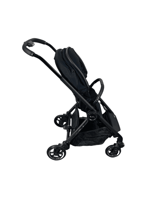 Silver Cross Dune stroller in stone color on a city street with canopy extended
