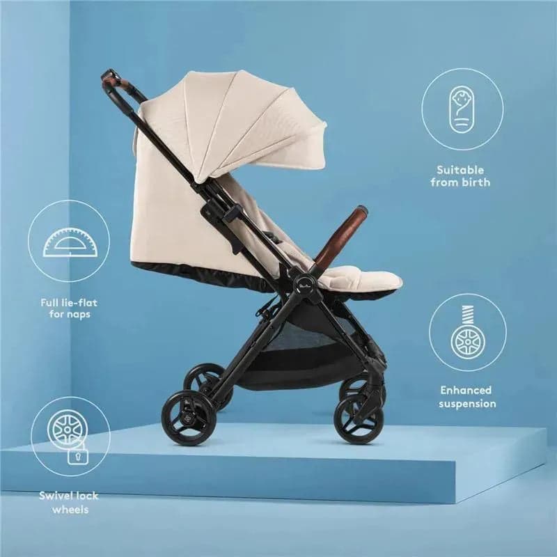 Silver Cross Jet 5 stroller in space grey folded compactly next to airplane overhead bin