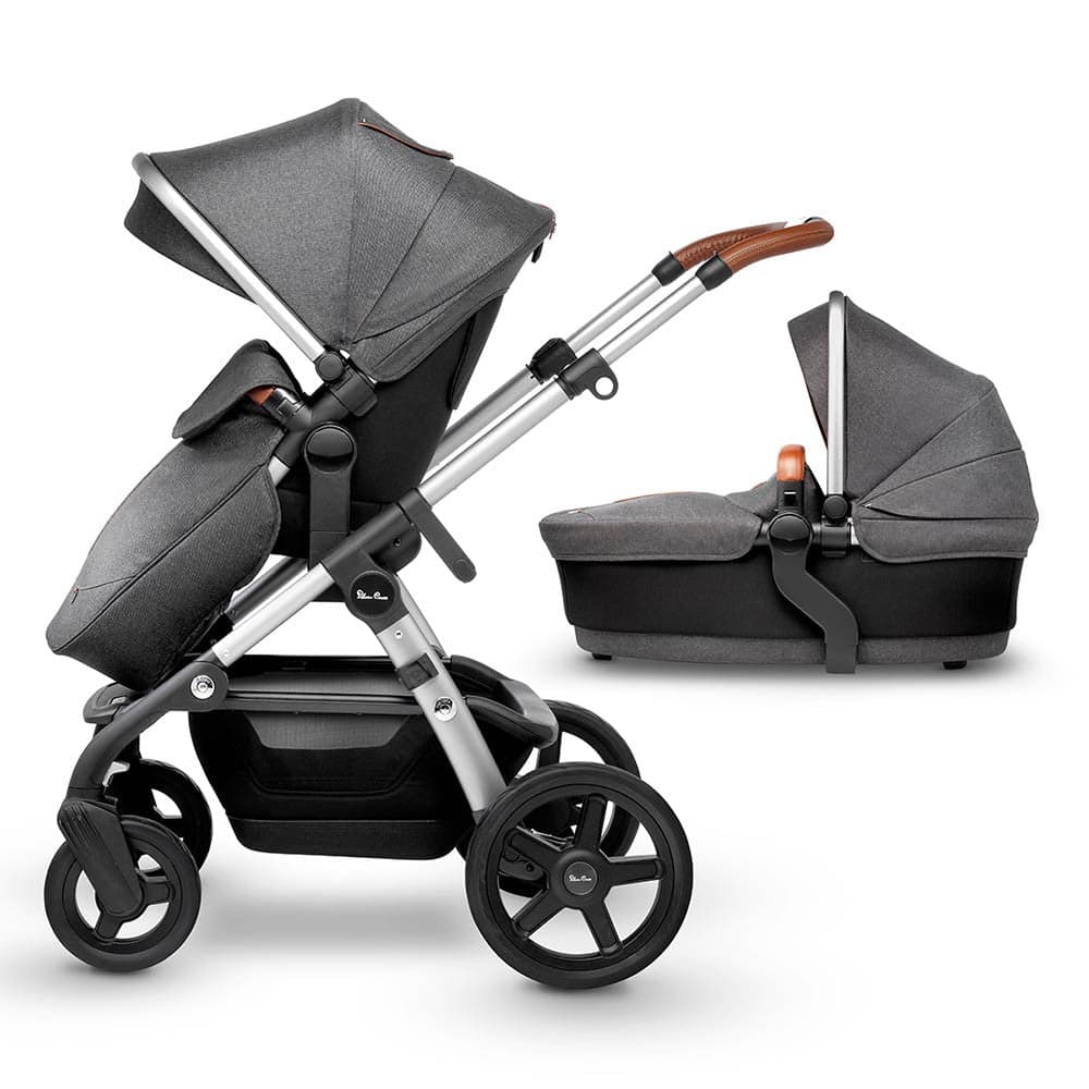 Silver Cross Wave convertible double stroller in Orbit color with bassinet and tandem seat on a city street