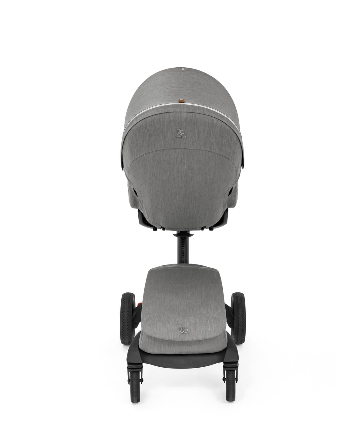 Stokke Xplory X stroller in royal blue with height-adjusted seat at table height in a cafe setting