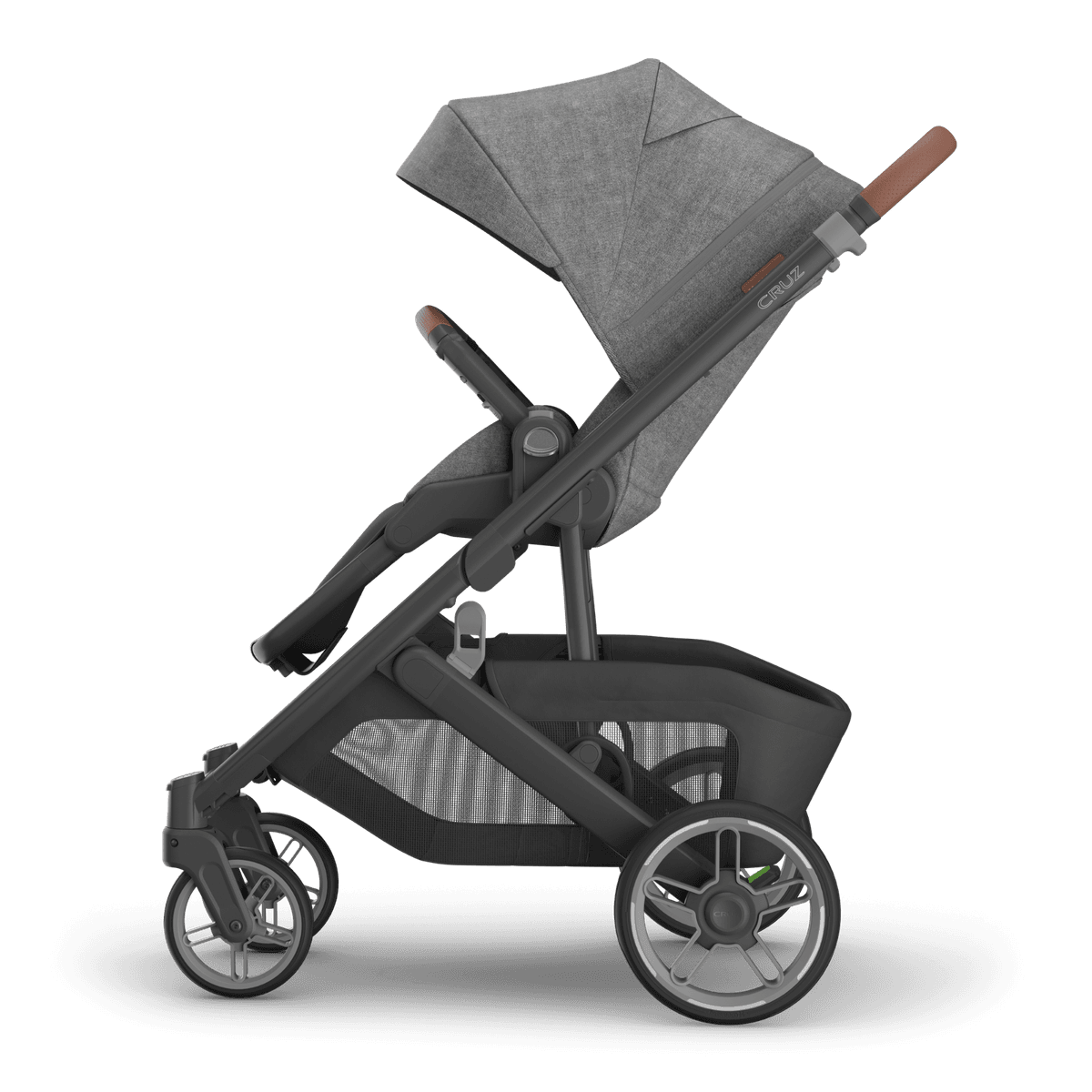 UPPAbaby Cruz V3 stroller in midnight navy on a city sidewalk with the seat in parent-facing mode
