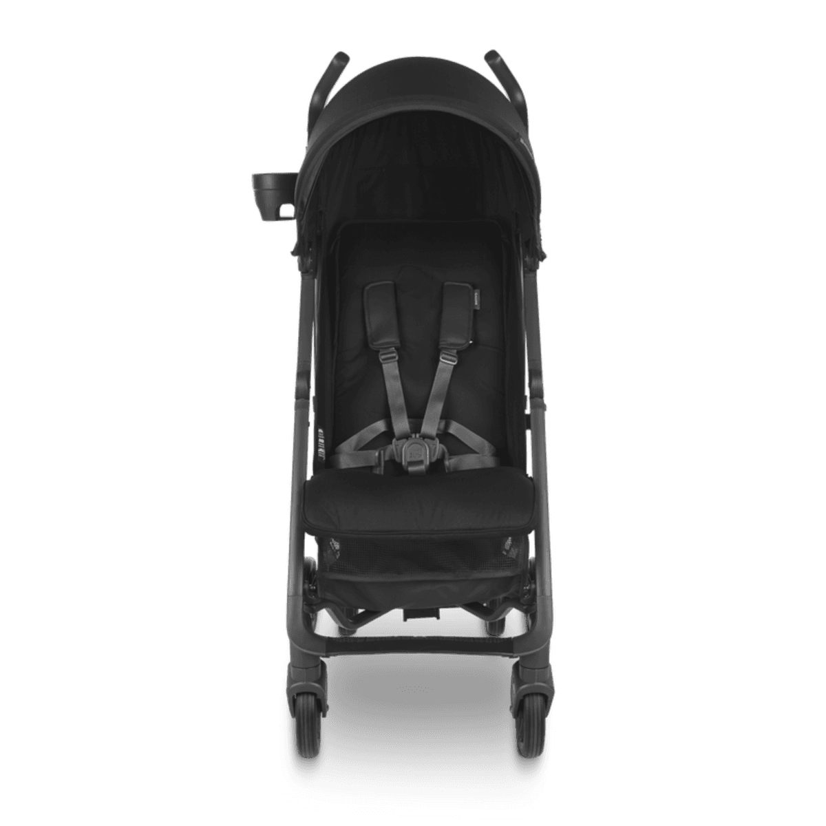 UPPAbaby G-Luxe umbrella stroller in navy color standing folded on a city sidewalk