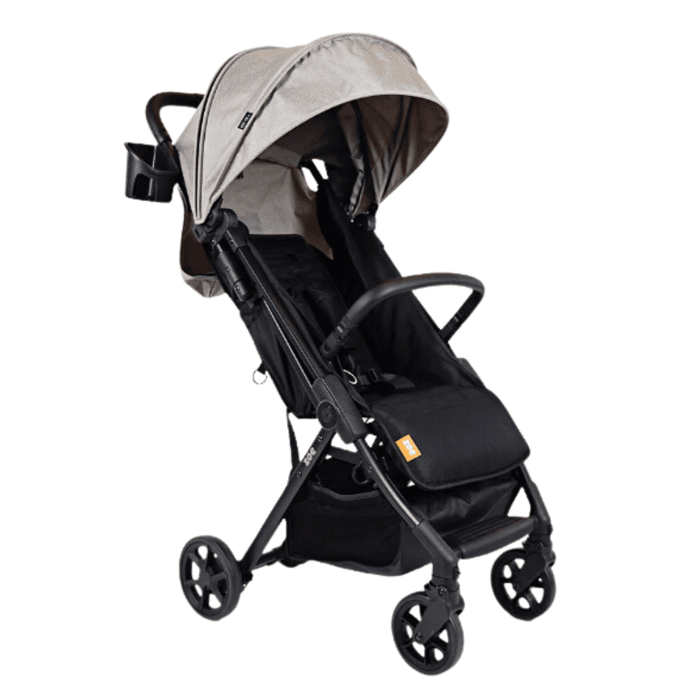 Zoe Tour+ stroller in black with 4-panel canopy extended on a city street