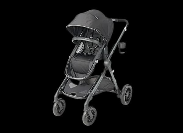 Evenflo Pivot Xpand stroller in Stallion Black in single mode on a suburban sidewalk