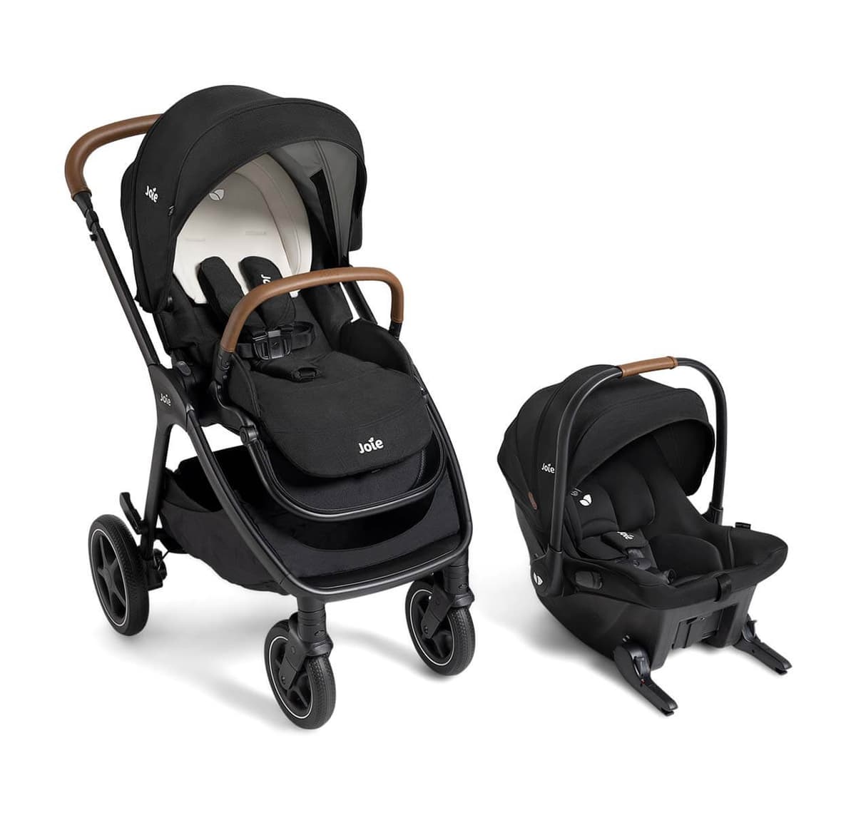 Joie Ginger & Mint Latch travel system with baseless infant car seat in Shale colorway on an urban sidewalk