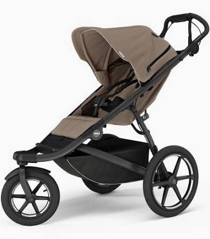 Thule Urban Glide 3 jogging stroller in sleek black with pneumatic tires on a smooth running path