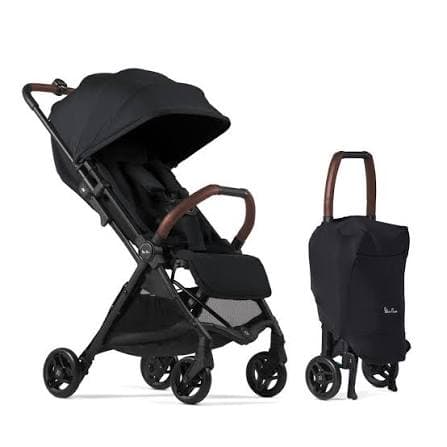 Silver Cross Jet 5 stroller in space grey folded compactly next to airplane overhead bin