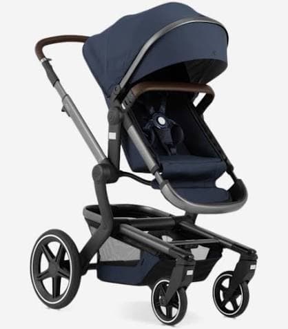 Joolz Day+ stroller in brilliant blue with bassinet on a park path in autumn