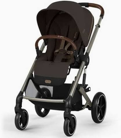 Cybex Balios S Lux 2 stroller in navy blue with vegan leather handlebar on a city street