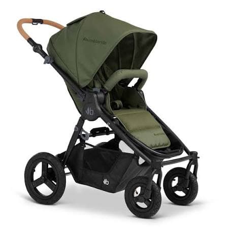 Bumbleride Era stroller in forest green with parent-facing seat in a city park setting