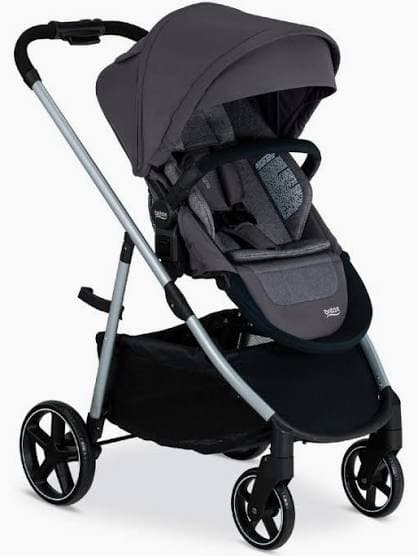 Britax Grove stroller in graphite navy with the seat parent-facing on a city sidewalk