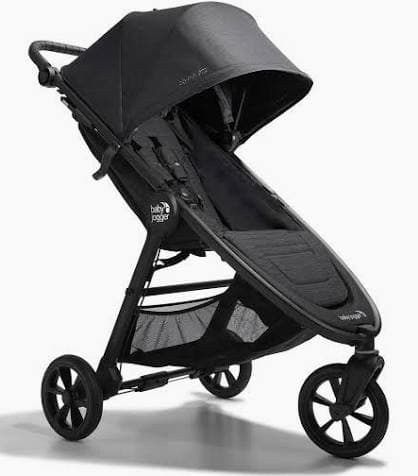 Britax B-Free stroller in black on a park path with multi-position recline seat visible