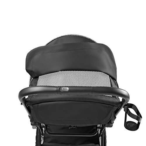 Summer Infant 3Dpac CS+ stroller in black with car seat adapter attached, compact fold position on a sidewalk
