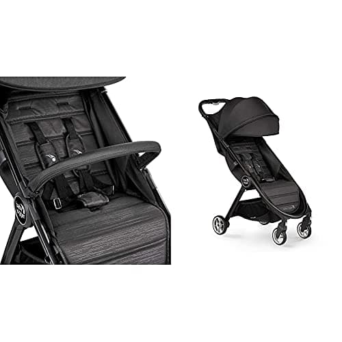 Baby Jogger City Tour 2 stroller in graphite color with included carry bag on a city street