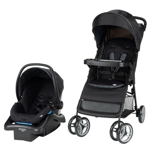 Cosco Lift & Stroll stroller in black on a city sidewalk, compact lightweight design