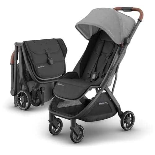 UPPAbaby Minu V3 stroller in jake black with infant in carriage mode at airport gate
