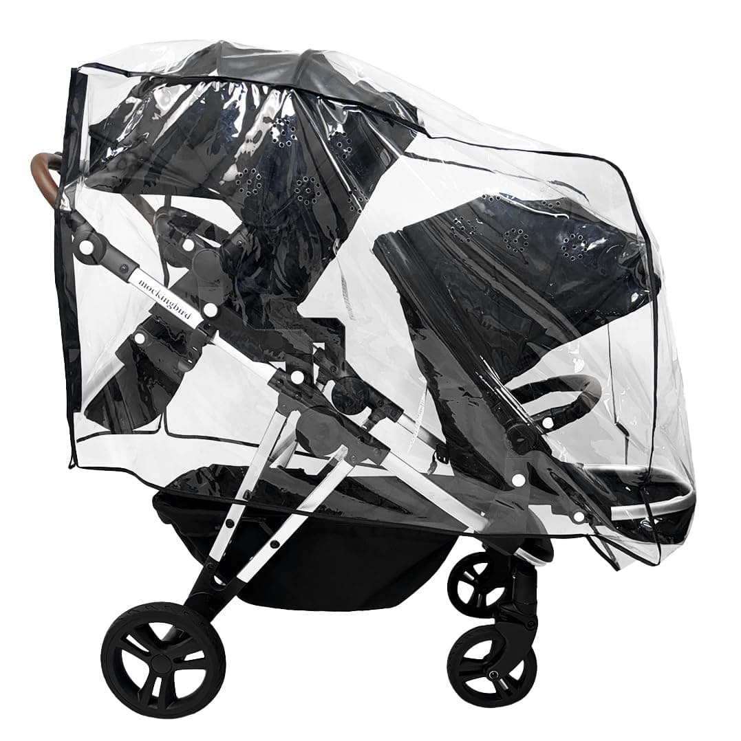 Mockingbird Single-to-Double 3.0 stroller in black configured as a double on an urban sidewalk