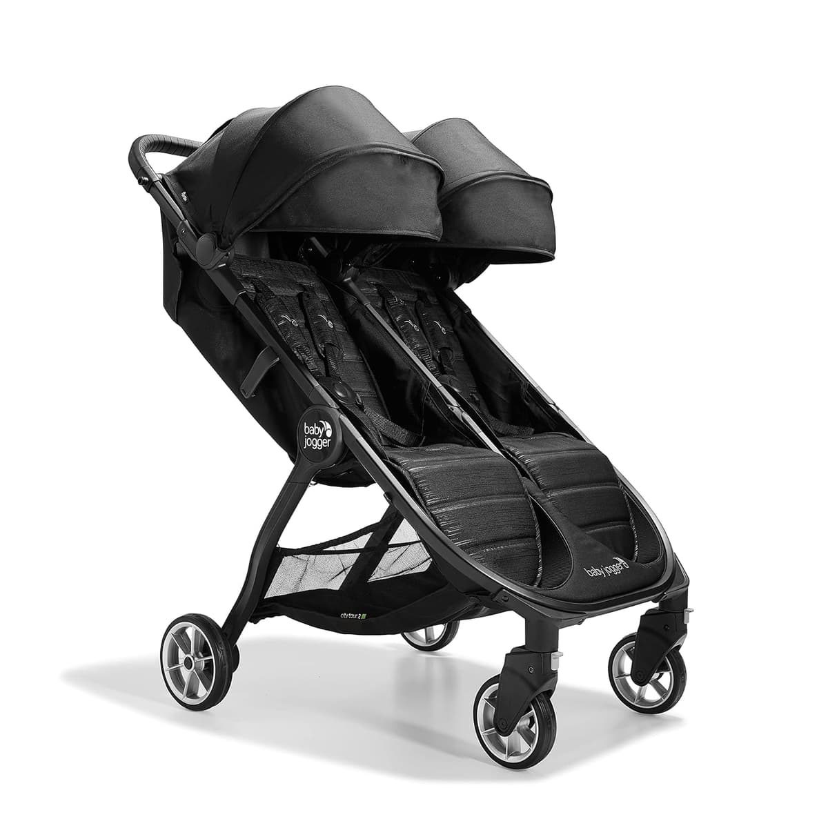 Baby Jogger City Tour 2 stroller in graphite color with included carry bag on a city street