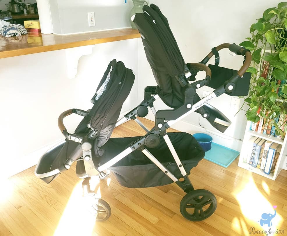 Mockingbird Single 3.0 stroller in black with FullShade canopy on a city sidewalk