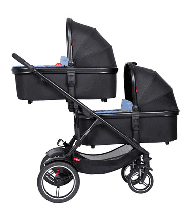 phil&teds Voyager inline double stroller in black with lie-flat main seat and double kit on an urban trail